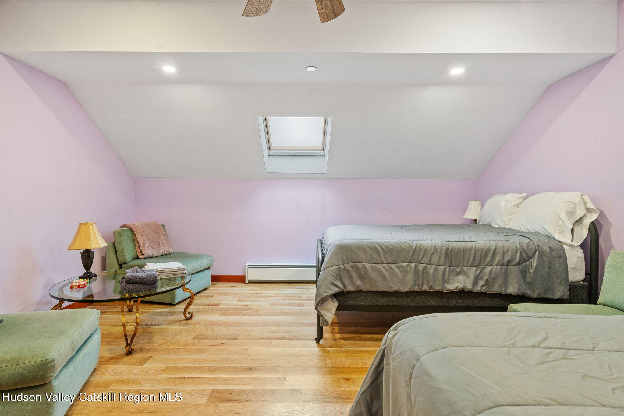 35 Scribner Hollow Road, Unit E3 Hunter, NY 12442 - Photo 38 of 59 a bedroom with a bed and a chair