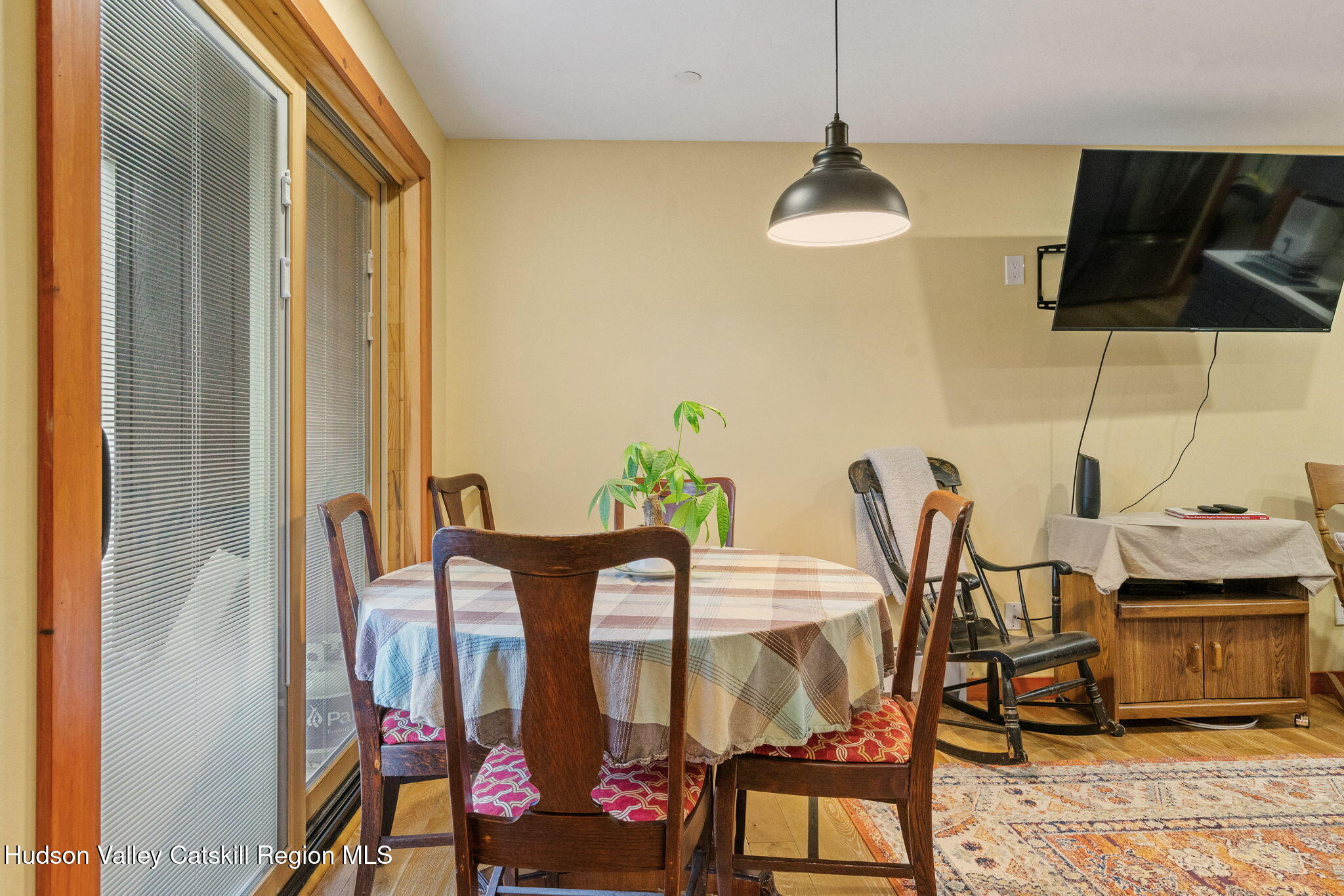 35 Scribner Hollow Road, Unit E3 Hunter, NY 12442 - Photo 43 of 59 a dining room with furniture and floor to ceiling windows