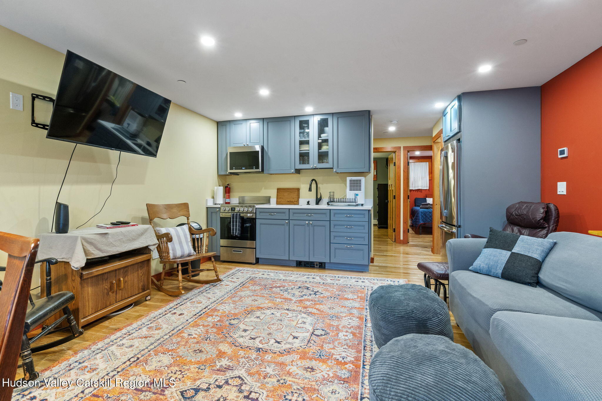 35 Scribner Hollow Road, Unit E3 Hunter, NY 12442 - Photo 44 of 59 a living room with furniture and a flat screen tv