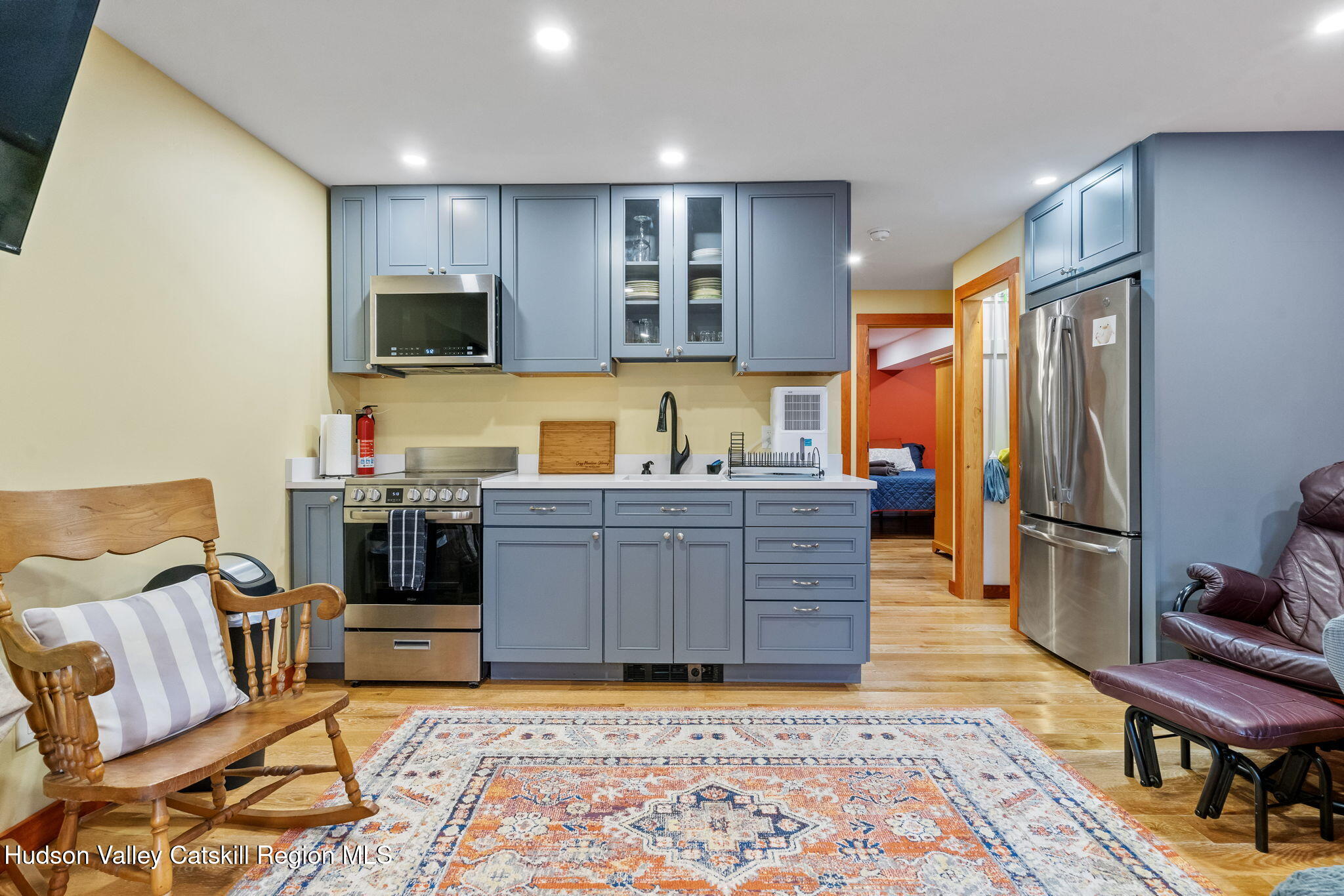 35 Scribner Hollow Road, Unit E3 Hunter, NY 12442 - Photo 45 of 59 a kitchen with a refrigerator and a cabinets