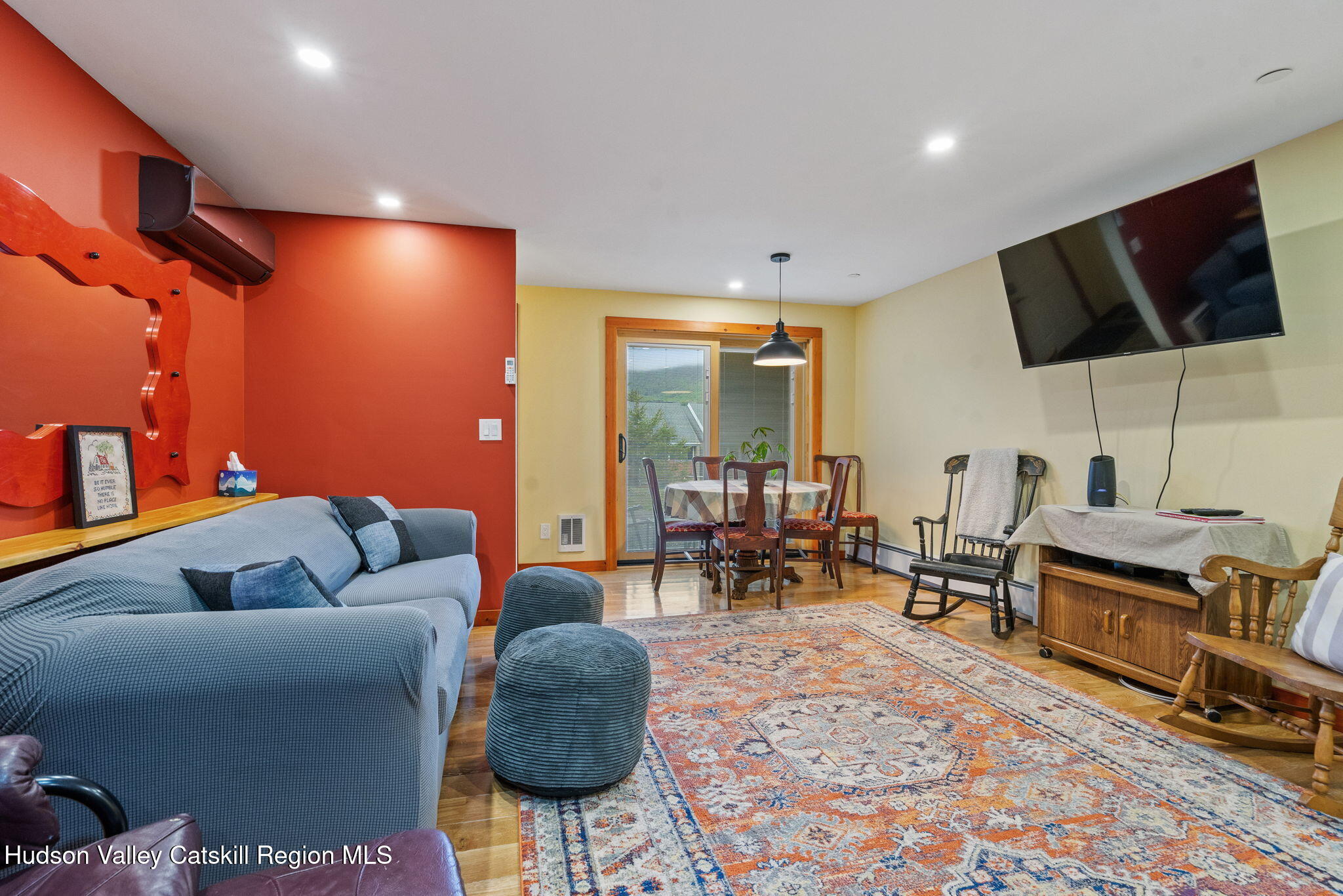 35 Scribner Hollow Road, Unit E3 Hunter, NY 12442 - Photo 48 of 59 a living room with furniture and a flat screen tv