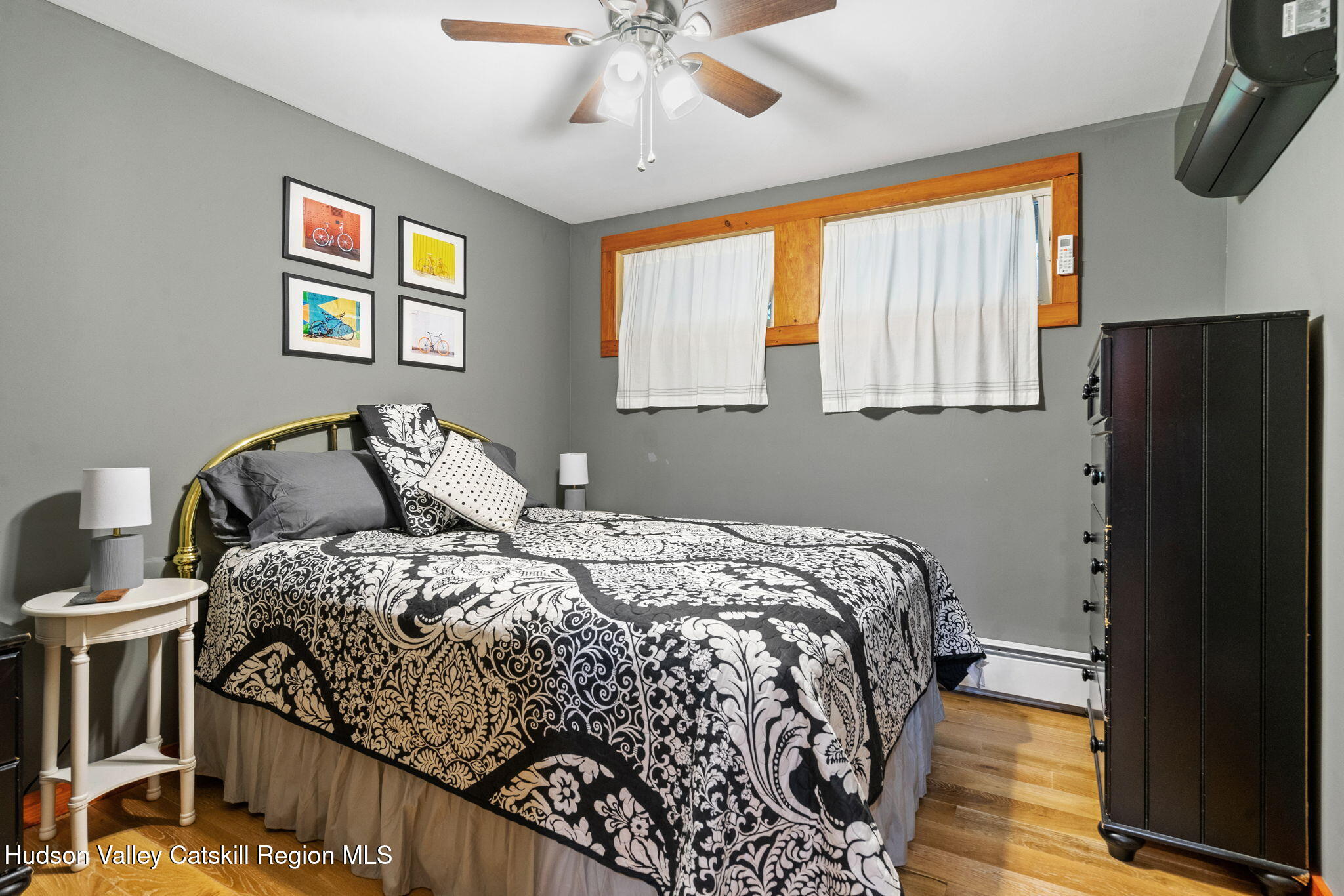 35 Scribner Hollow Road, Unit E3 Hunter, NY 12442 - Photo 52 of 59 a bedroom with a bed and a window