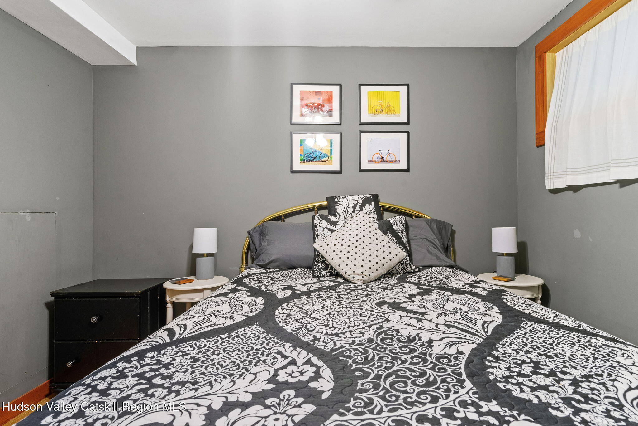 35 Scribner Hollow Road, Unit E3 Hunter, NY 12442 - Photo 53 of 59 a bedroom with a bed and wooden floor