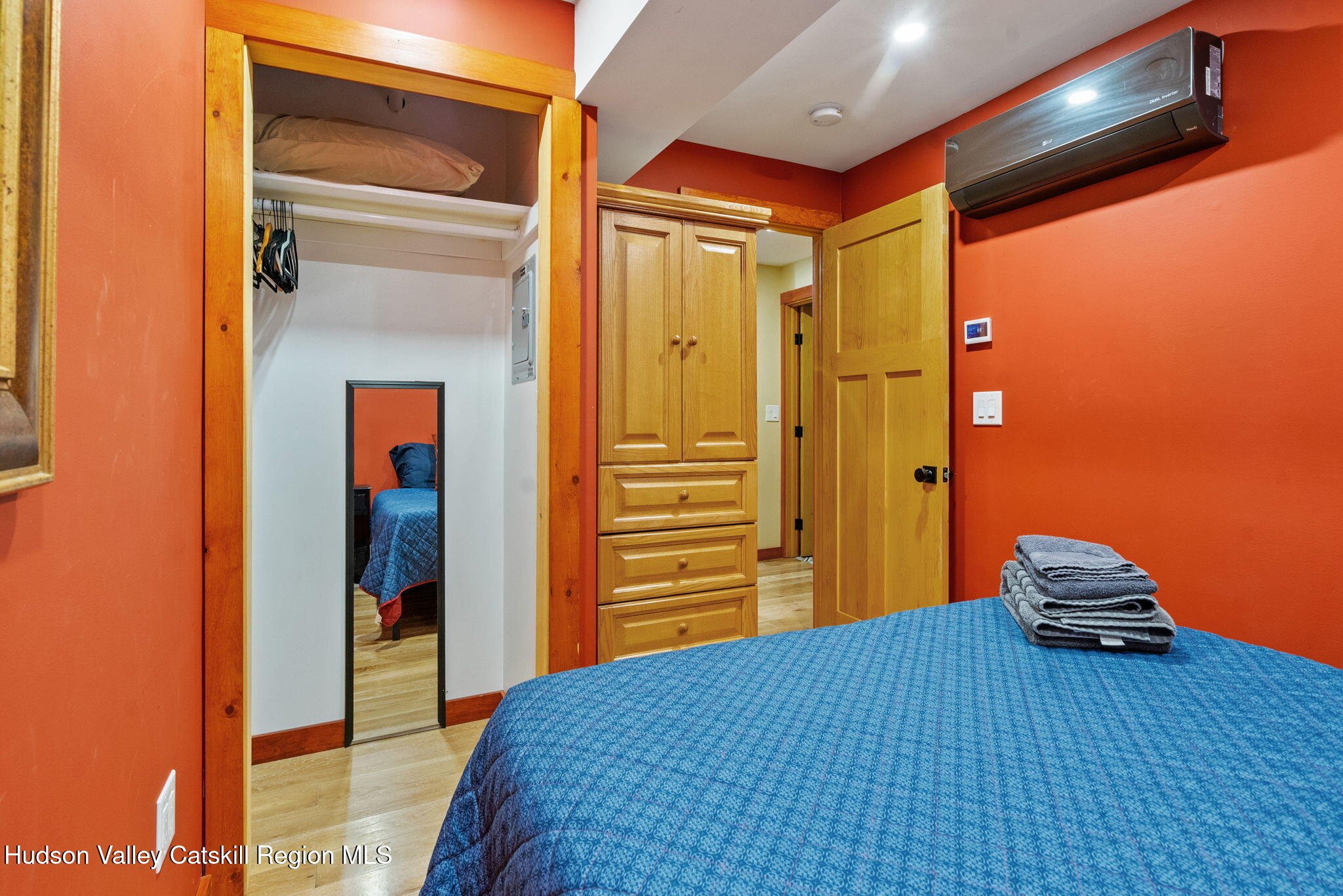 35 Scribner Hollow Road, Unit E3 Hunter, NY 12442 - Photo 56 of 59 a bedroom with a bed and wooden floor