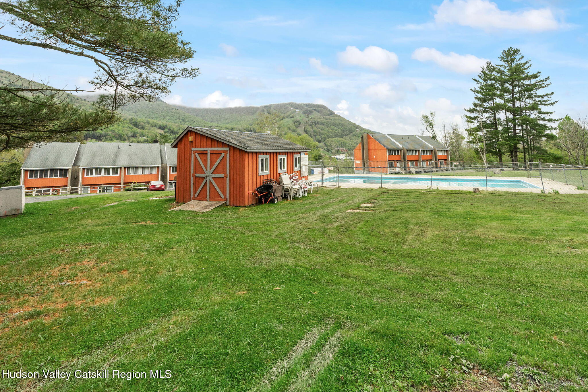 35 Scribner Hollow Road, Unit E3 Hunter, NY 12442 - Photo 57 of 59 a view of a house with a big yard and large trees
