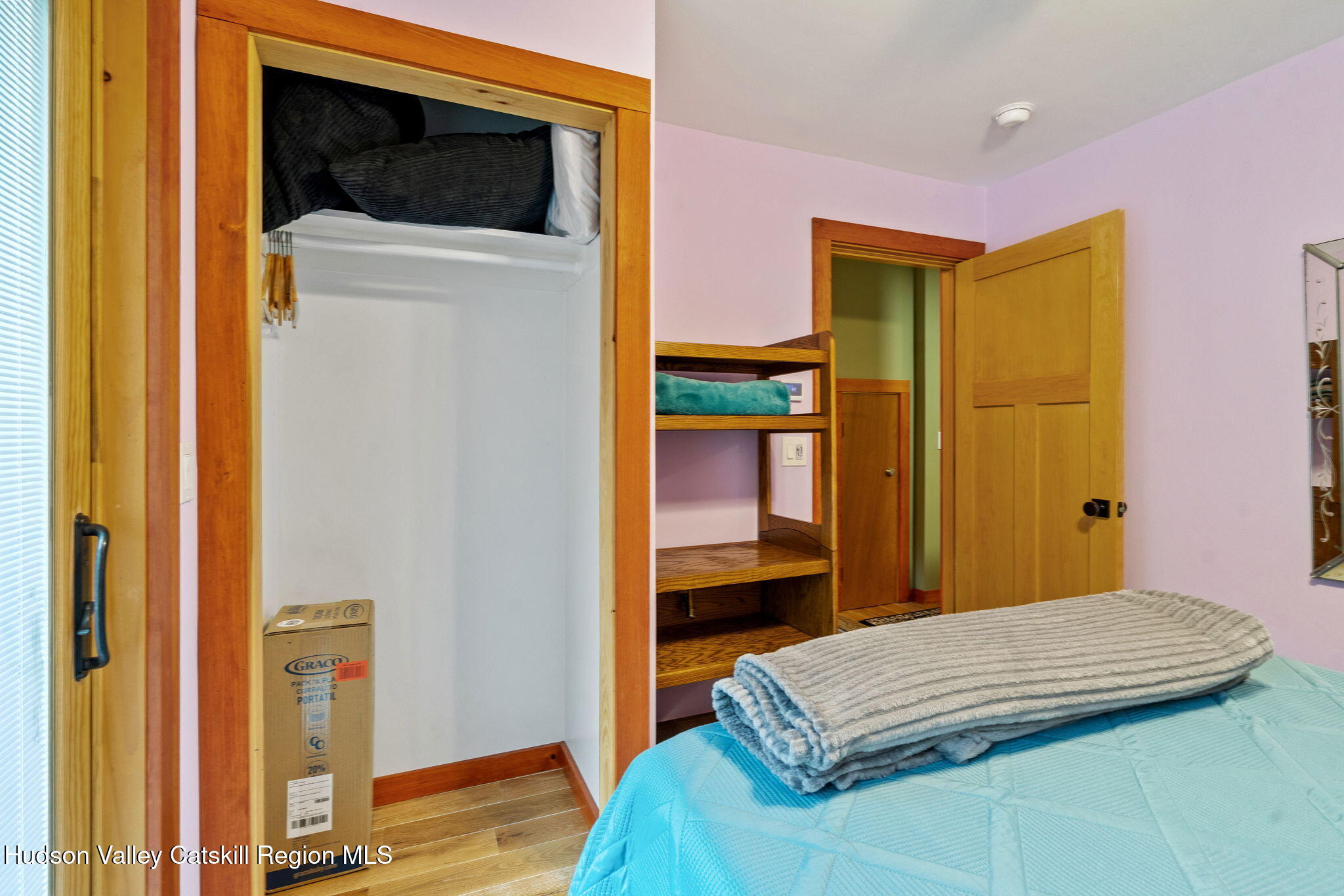 35 Scribner Hollow Road, Unit E3 Hunter, NY 12442 - Photo 9 of 59 a bedroom with a bed and a closet