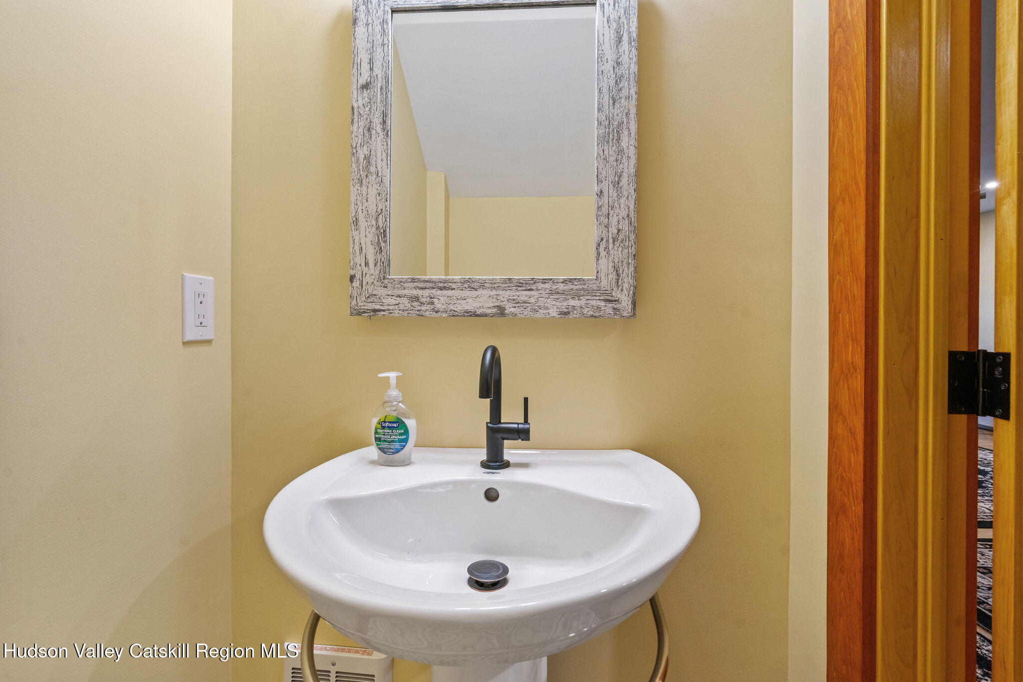 35 Scribner Hollow Road, Unit E3 Hunter, NY 12442 - Photo 10 of 59 a bathroom with a sink and a mirror