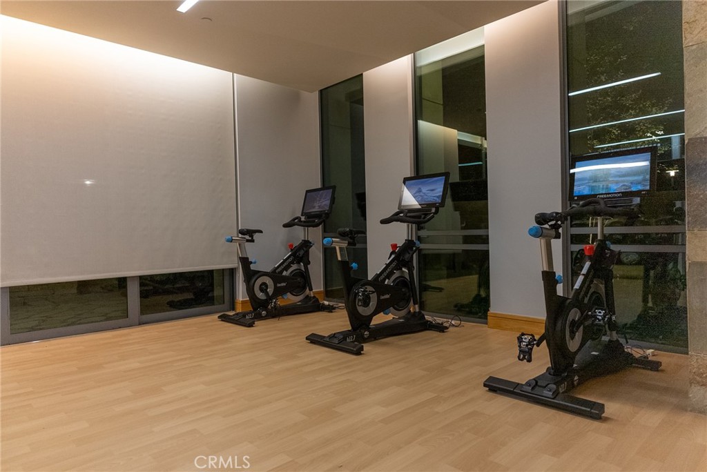 21 Gramercy, Unit 102 Irvine, CA 92612 - Photo 27 of 30 State of the art fitness center featuring premium equipment and modern design.