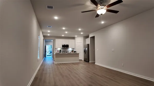 a view of a livingroom with chandelier furniture and entryway