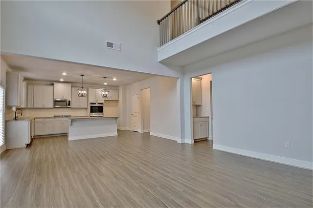 a bathroom with a granite countertop shower and a sink