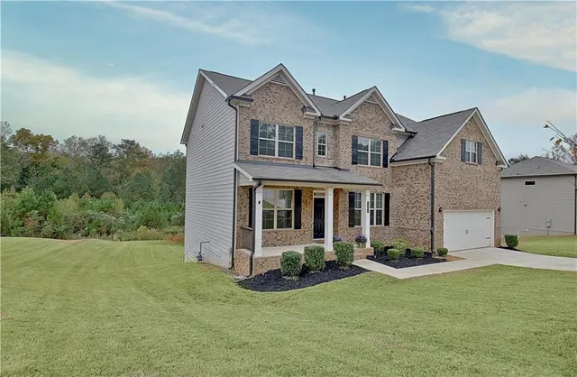 front view of a house with a yard
