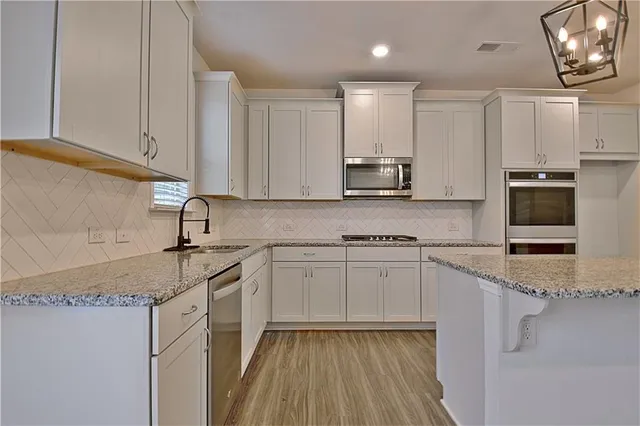 a bathroom with a toilet a sink and a mirror