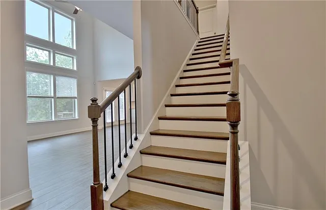 a spacious bathroom with a double vanity sink and a mirror