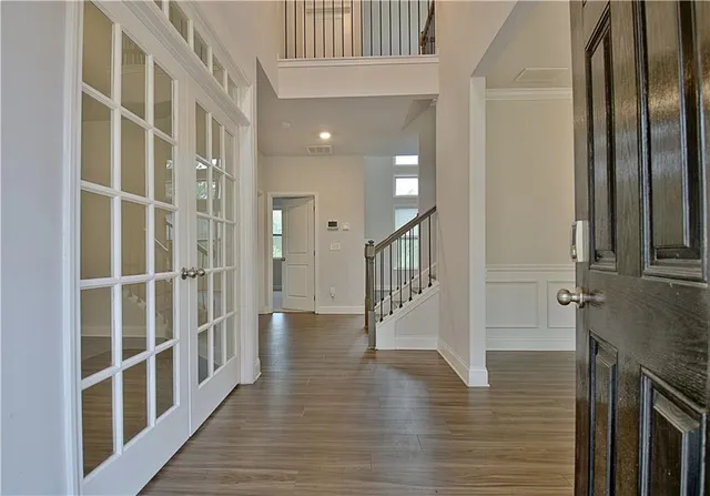 a view of entryway with wooden floor
