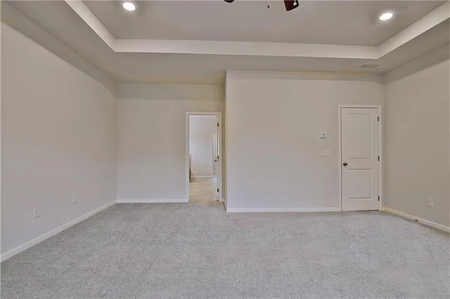 a view of hallway with wooden floor