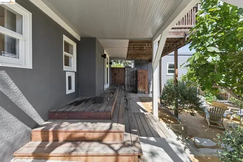a view of a chairs and table in patio