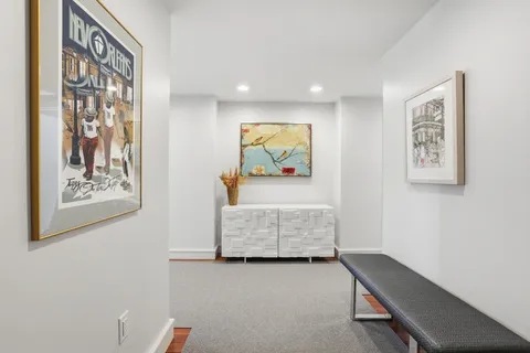 a view of room with furniture and wooden floor