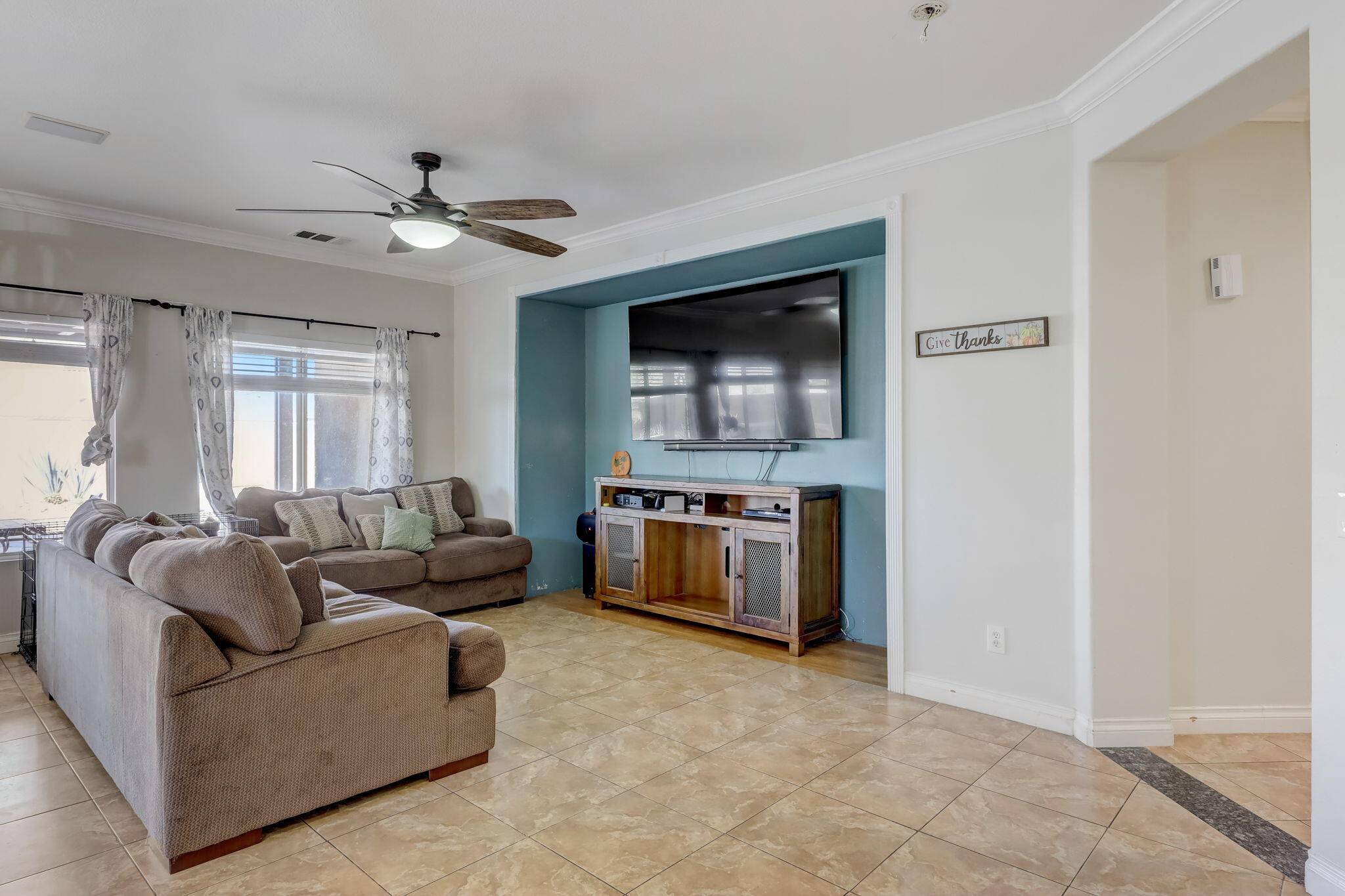 41163 Morris Street Indio, CA 92203 - Photo 15 of 83 a living room with furniture and a flat screen tv