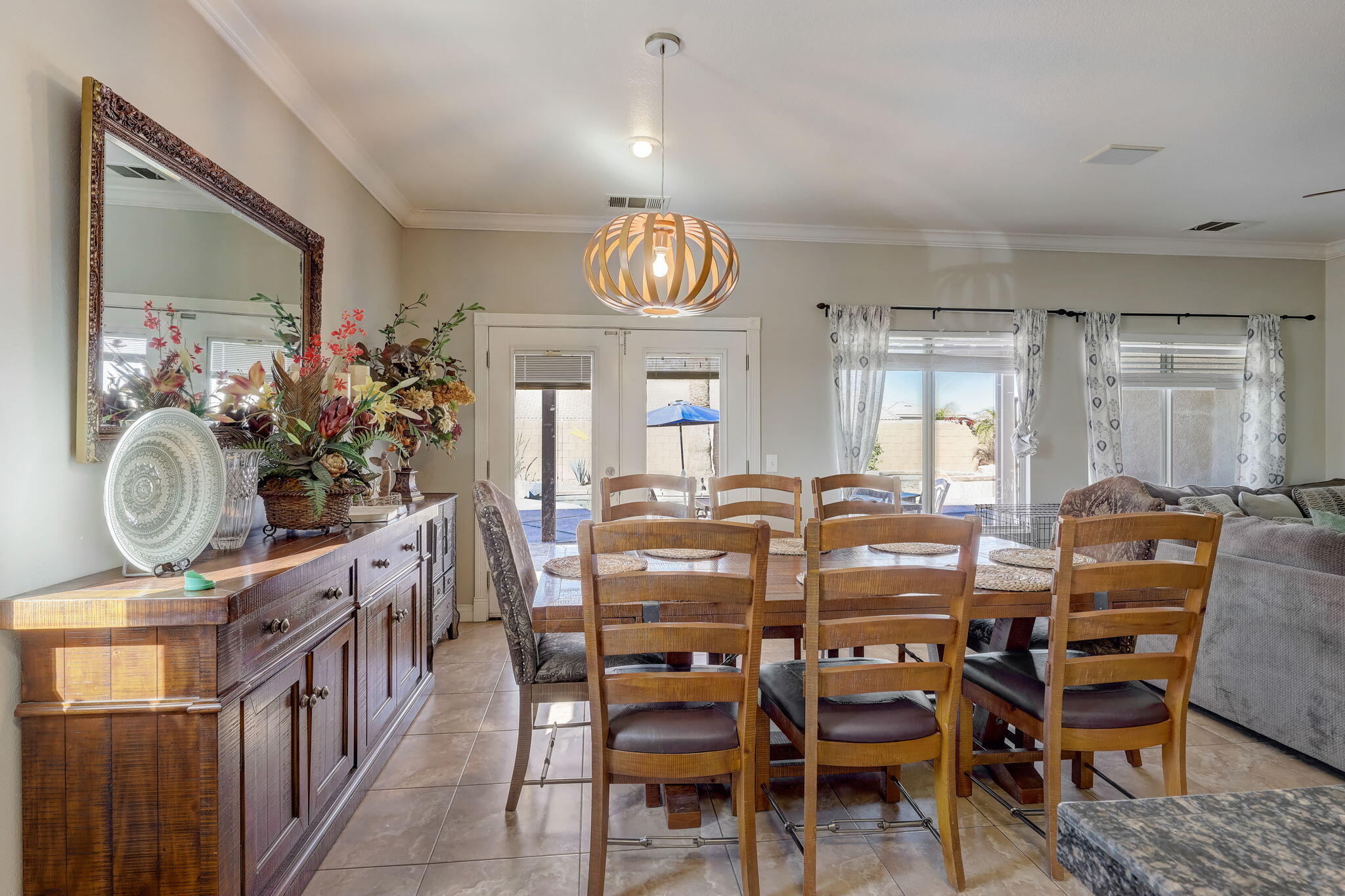 41163 Morris Street Indio, CA 92203 - Photo 16 of 83 a view of a dining room with furniture window and wooden floor