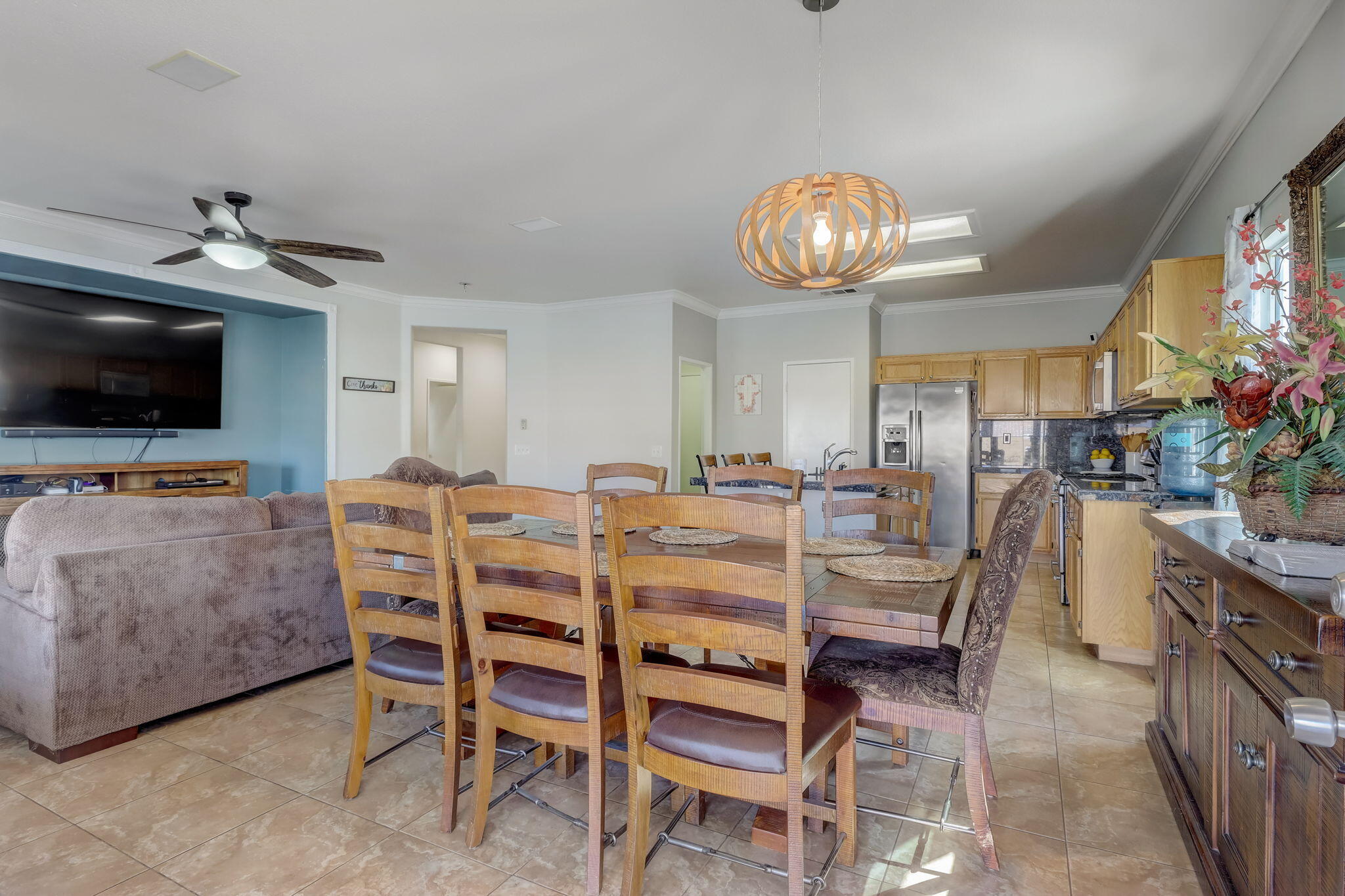 41163 Morris Street Indio, CA 92203 - Photo 21 of 83 a view of a dining room with furniture and a flat screen tv