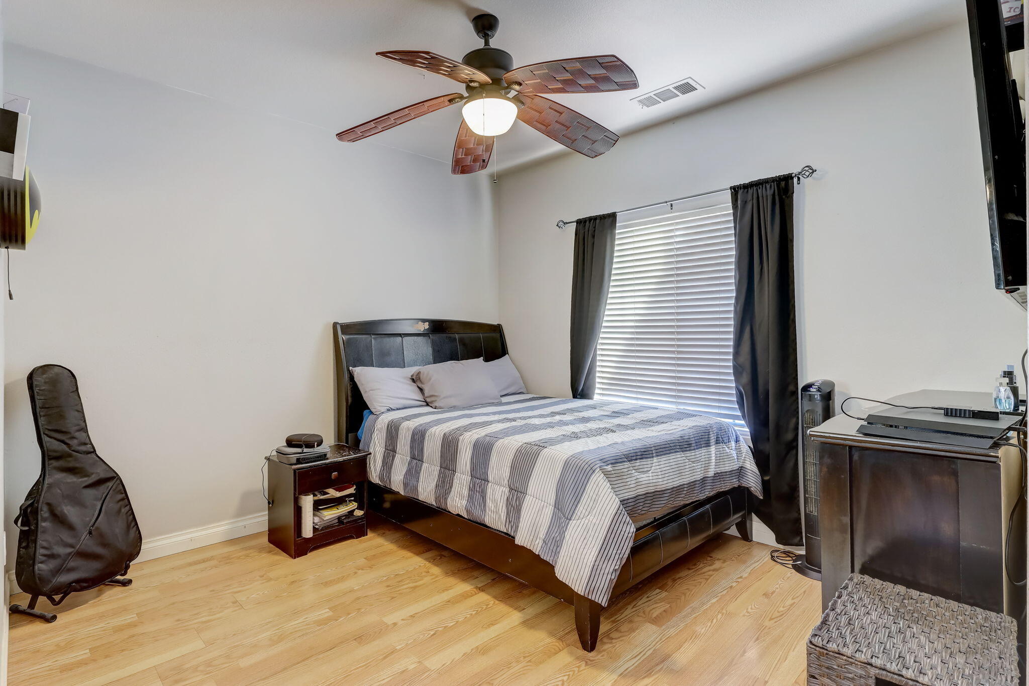 41163 Morris Street Indio, CA 92203 - Photo 26 of 83 a bedroom with a bed and a chandelier