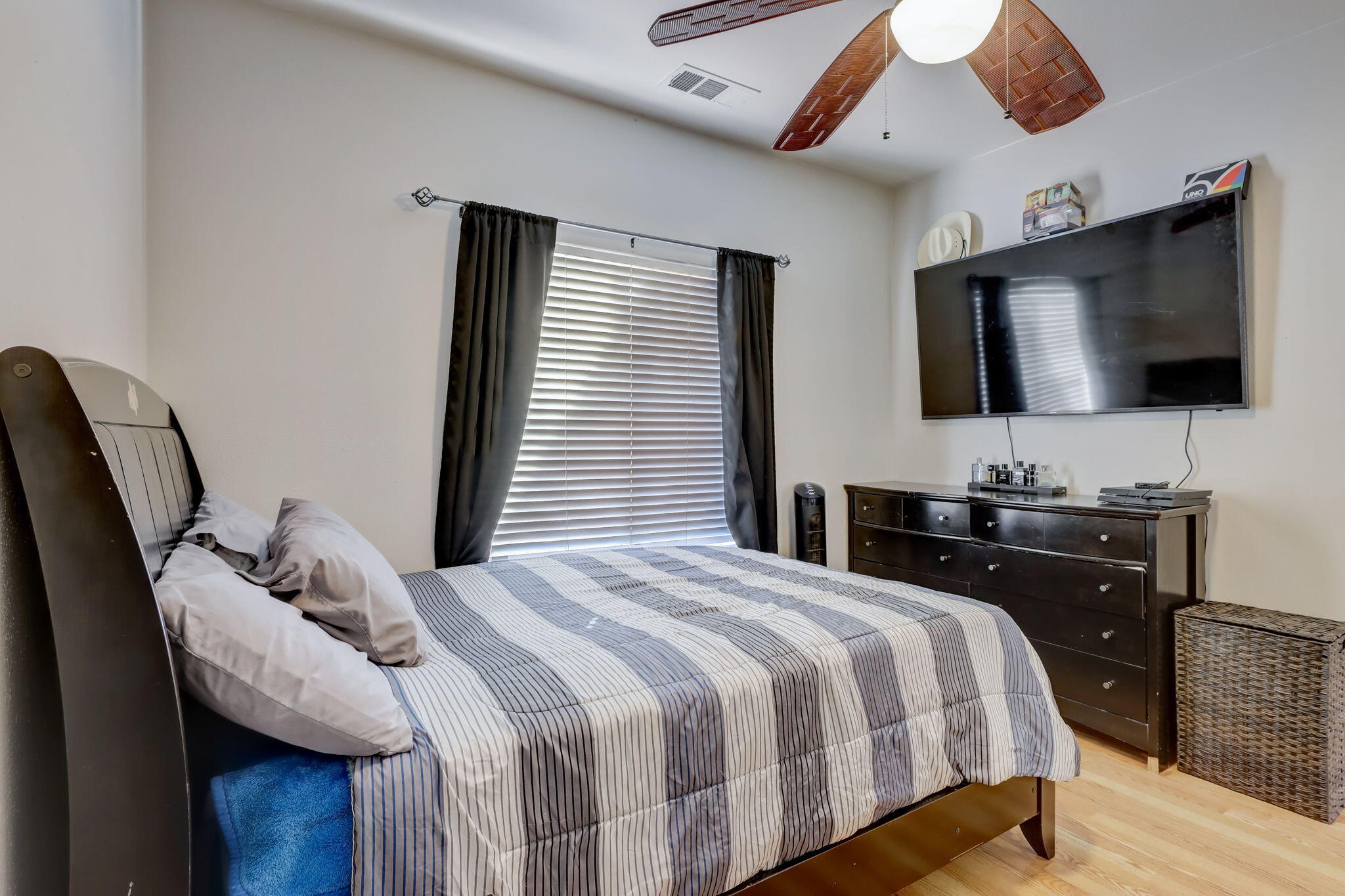 41163 Morris Street Indio, CA 92203 - Photo 27 of 83 a bedroom with a bed and a flat screen tv