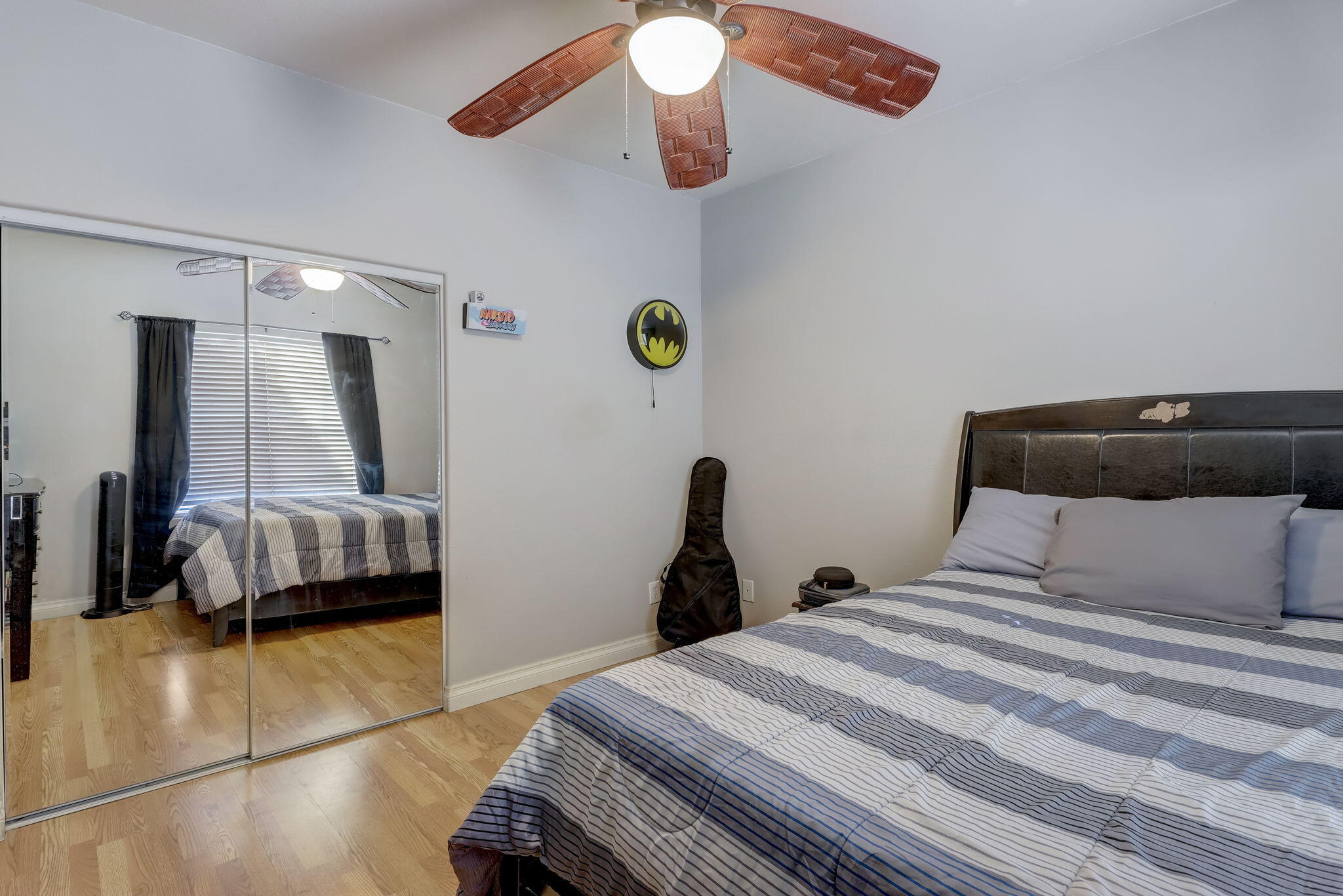 41163 Morris Street Indio, CA 92203 - Photo 29 of 83 a bedroom with a bed and a chandelier