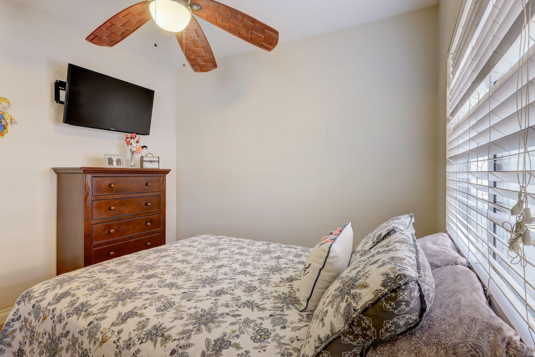 41163 Morris Street Indio, CA 92203 - Photo 32 of 83 a bedroom with a bed and a flat screen tv