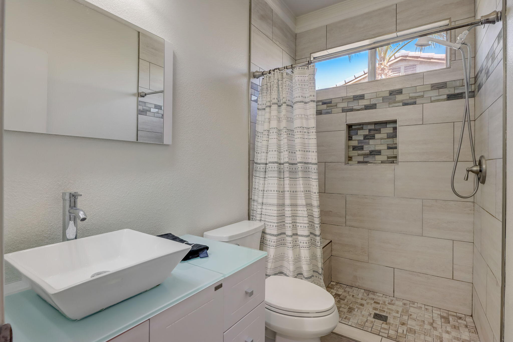 41163 Morris Street Indio, CA 92203 - Photo 34 of 83 a bathroom with a sink a toilet and shower