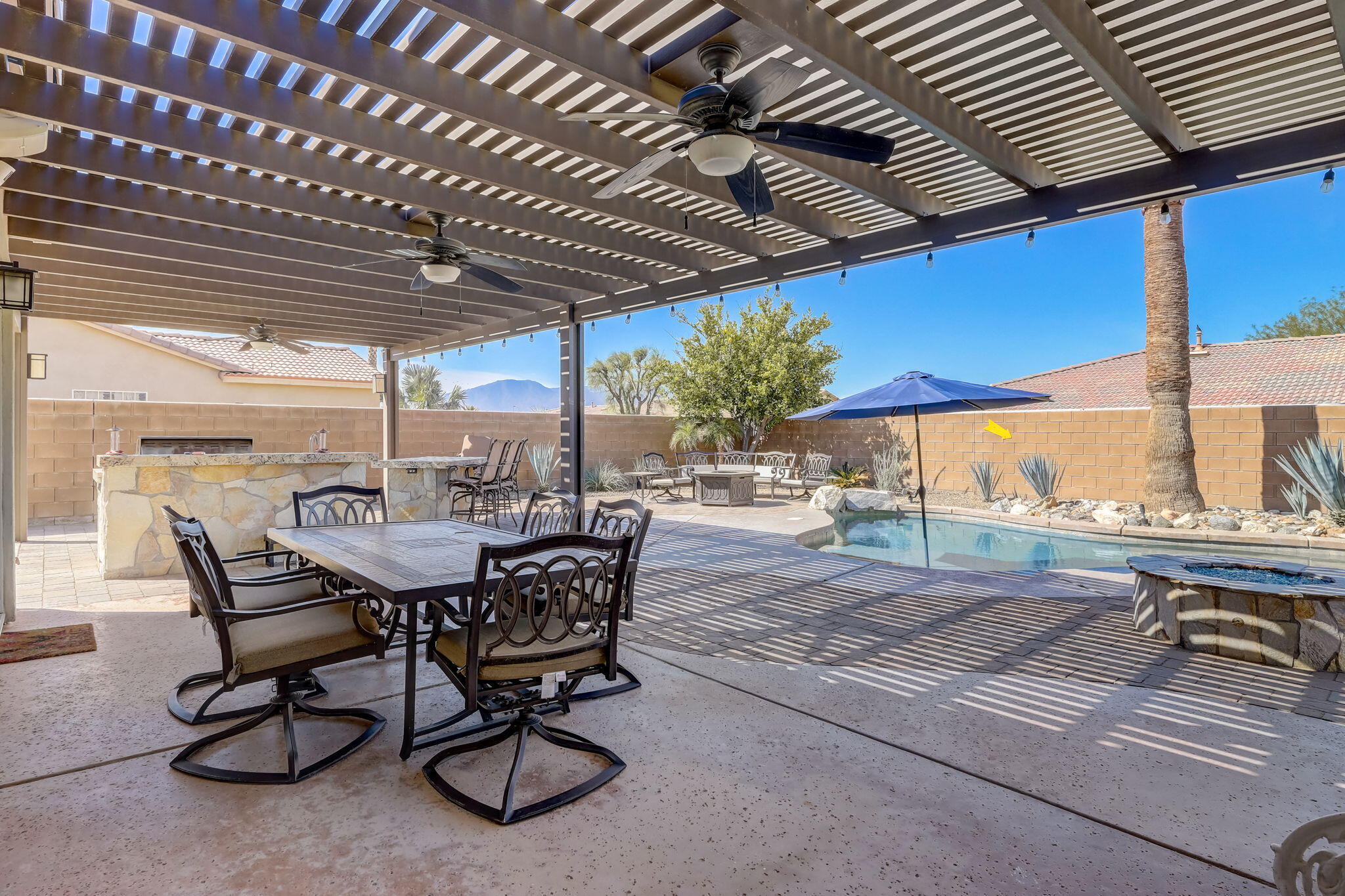 41163 Morris Street Indio, CA 92203 - Photo 45 of 83 a view of a porch with furniture and a yard