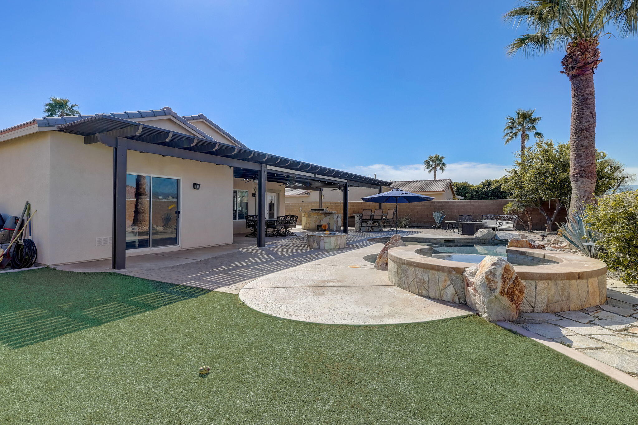 41163 Morris Street Indio, CA 92203 - Photo 47 of 83 a view of a house with backyard and sitting area