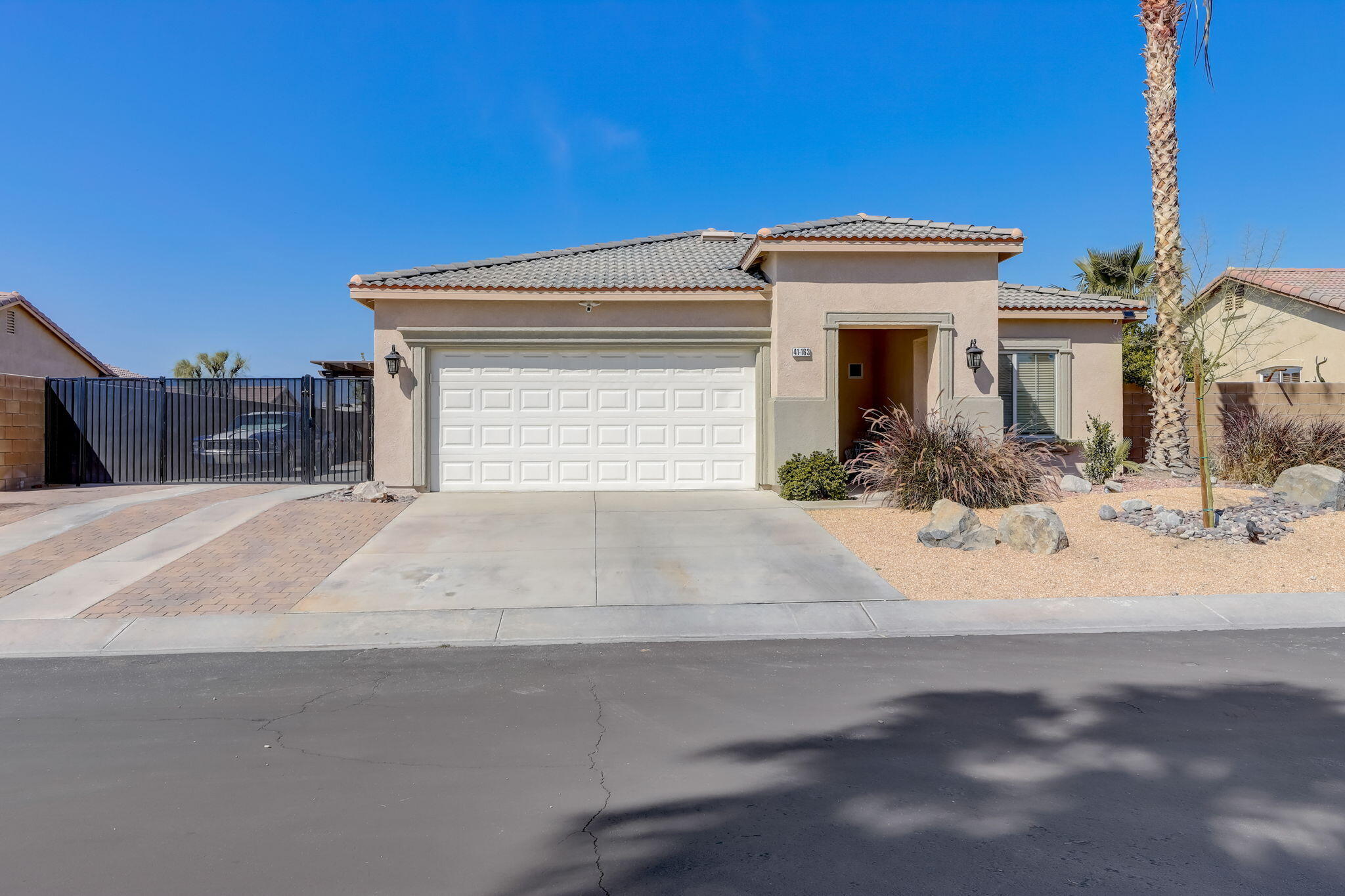 41163 Morris Street Indio, CA 92203 - Photo 5 of 83 a view of a house with a small yard