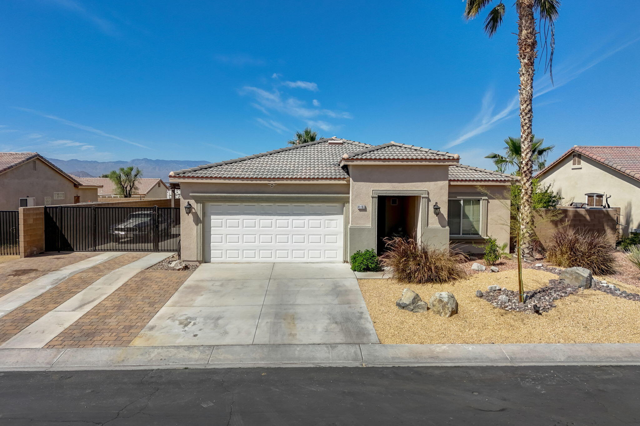41163 Morris Street Indio, CA 92203 - Photo 56 of 83 a front view of a house with a yard