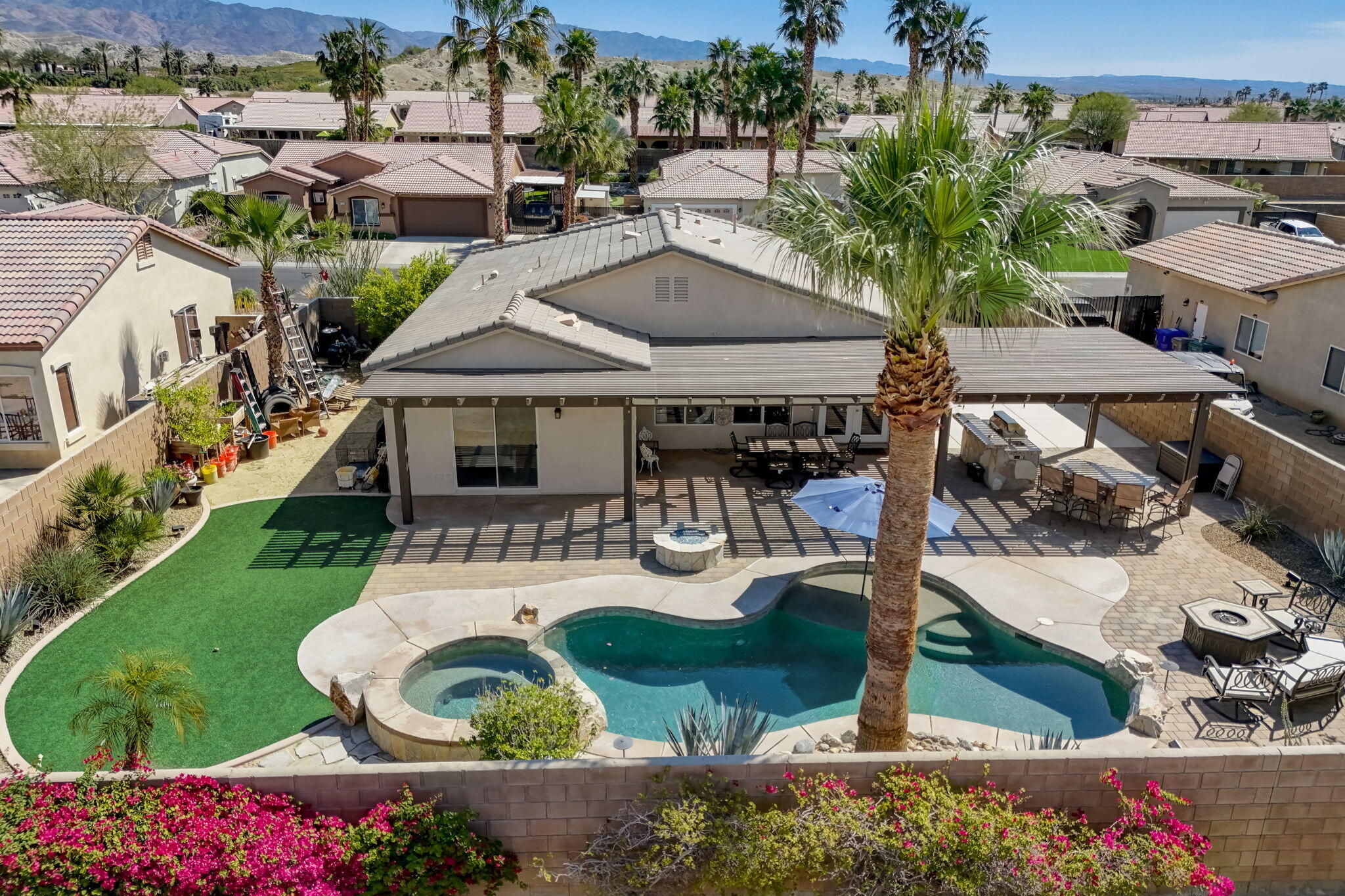 41163 Morris Street Indio, CA 92203 - Photo 63 of 83 an aerial view of a house with garden space and lake view