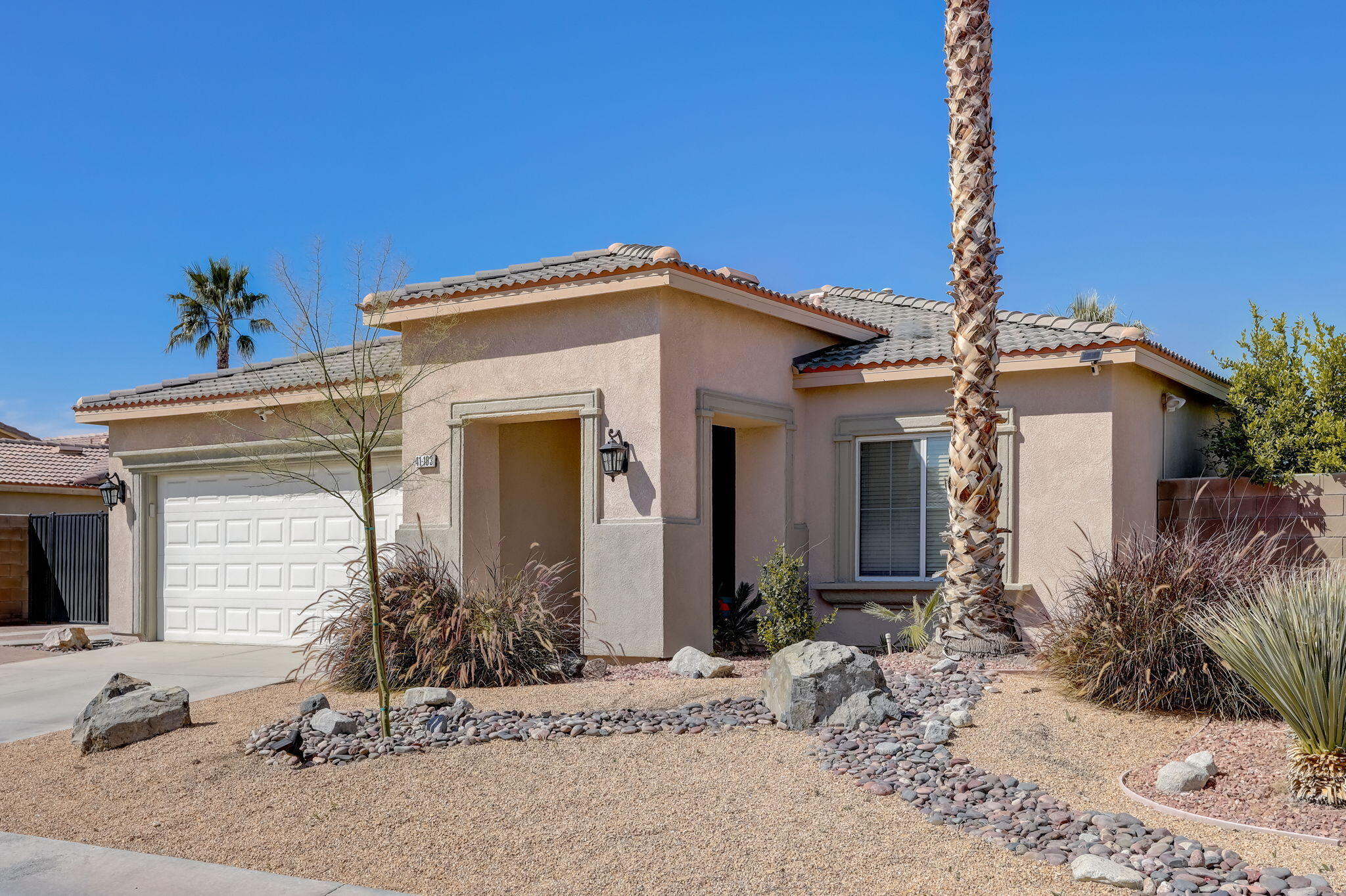 41163 Morris Street Indio, CA 92203 - Photo 8 of 83 a front view of a house with garden
