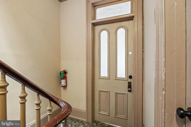 a view of front door with stairs