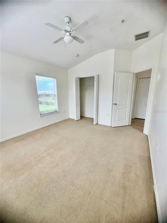 6404 South Goldenrod Road, Unit 2A Orlando, FL 32822 - Photo 19 of 40 a view of an empty room with a window