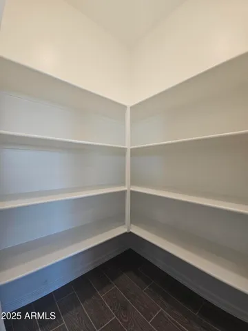 a storage room with a wooden floor