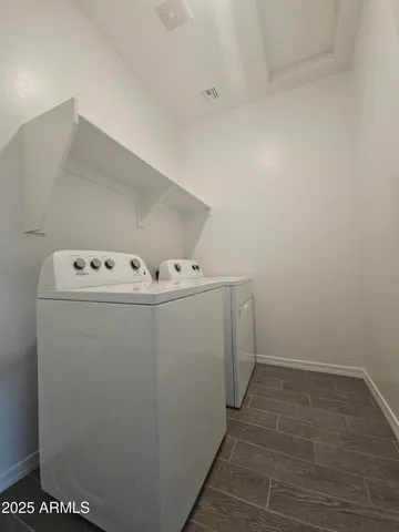 a utility room with dryer and washer