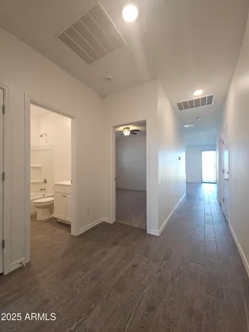 a view of a room with an empty space and a gallery