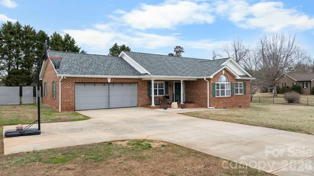 a view of a patio with a dining table and chairs with wooden floor