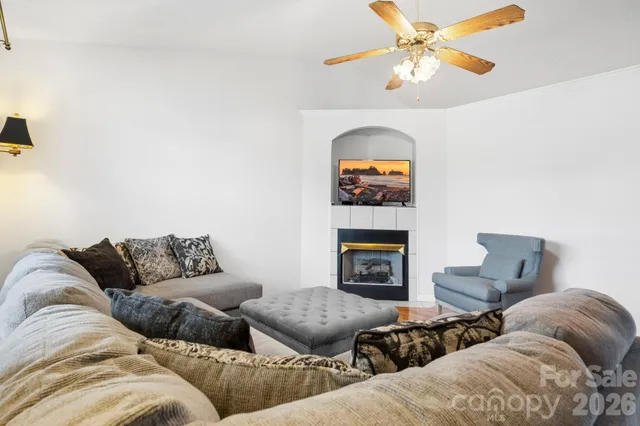 a living room with furniture and a fireplace