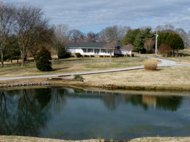 206 Guill Road Mount Juliet, TN 37122 - Photo 1 of 20 View from road. Fishing pond in front yard, not far to go to catch that big one.