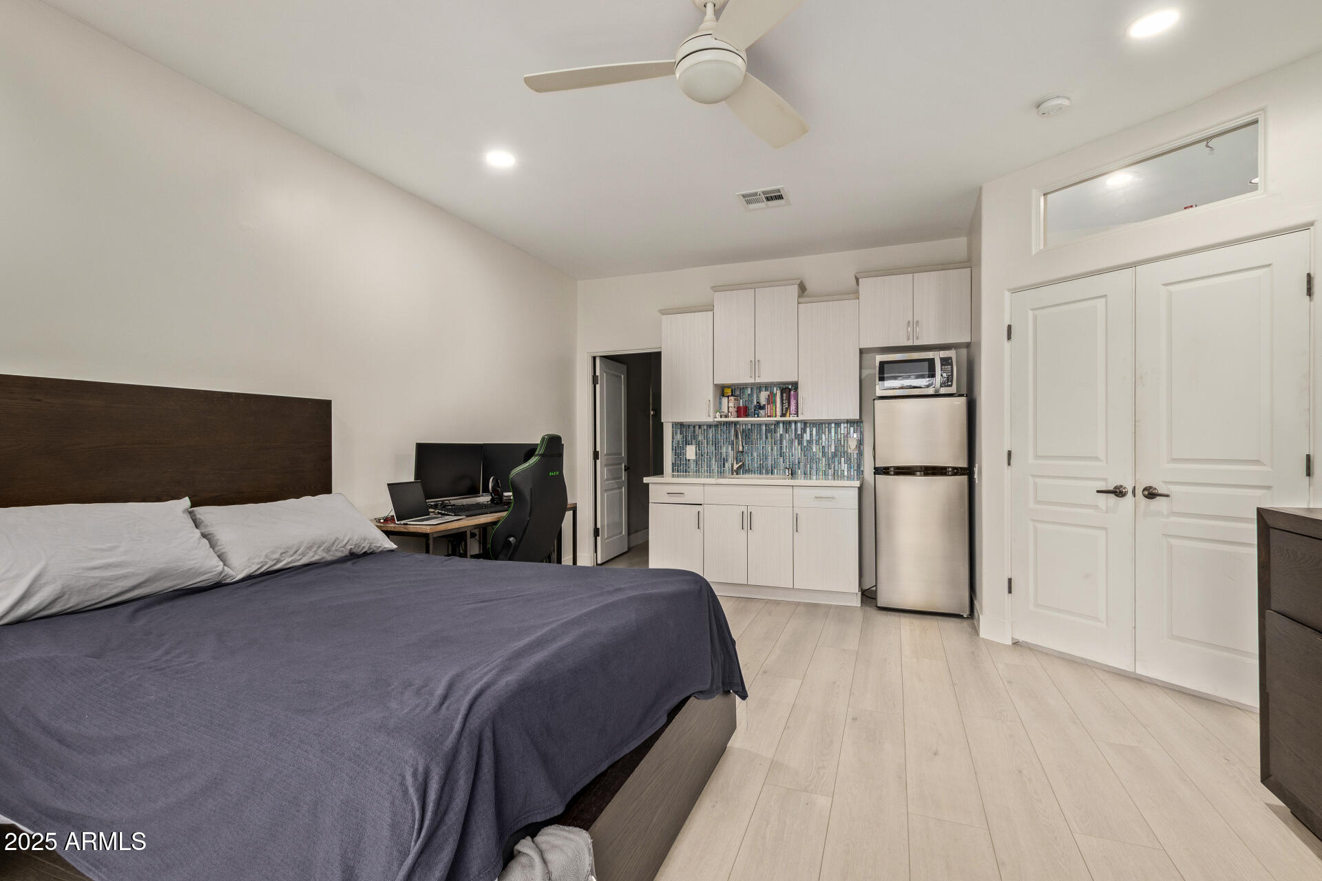 10011 North 1st Avenue Phoenix, AZ 85021 - Photo 12 of 23 a large bedroom with a bed and ceiling fan