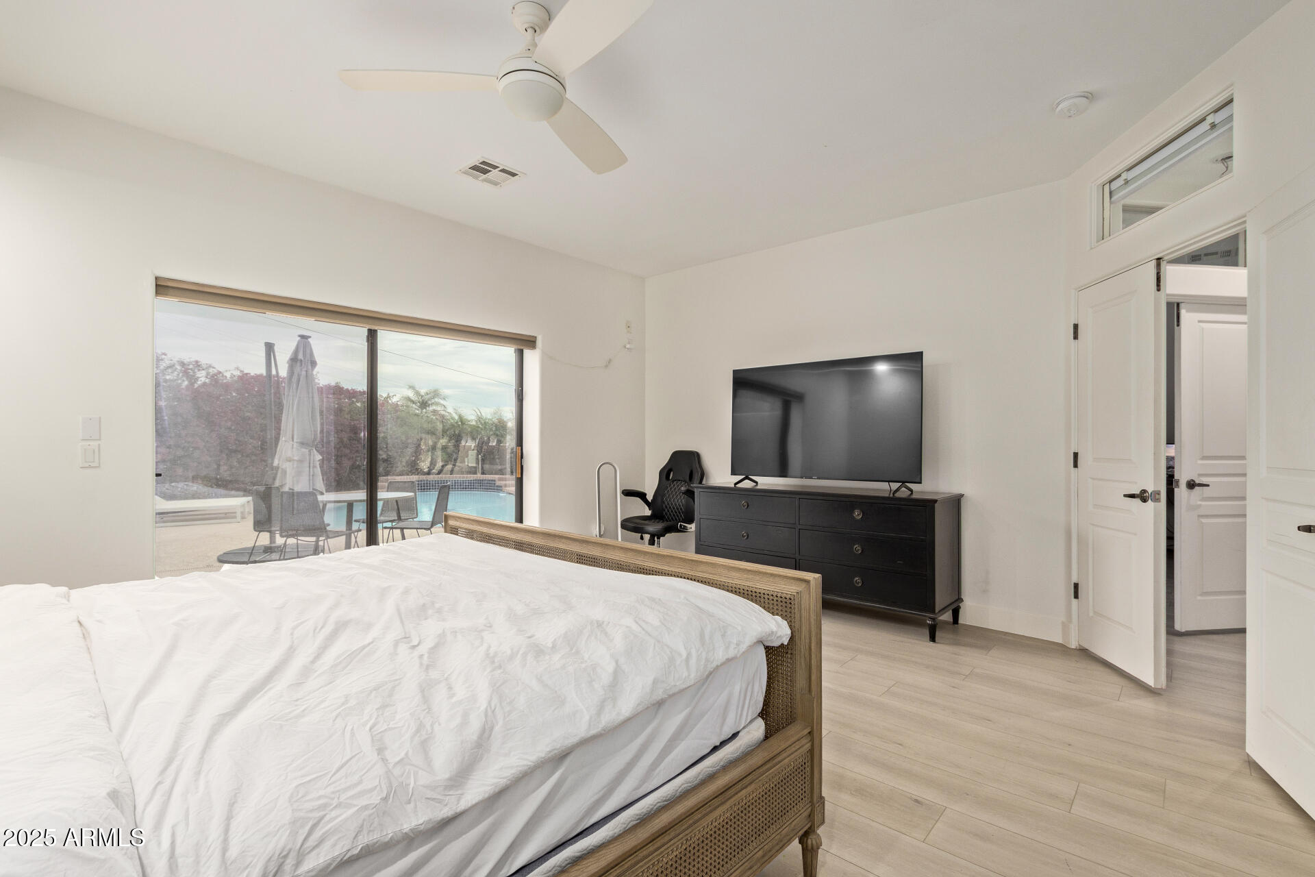 10011 North 1st Avenue Phoenix, AZ 85021 - Photo 14 of 23 a bedroom with a bed and a flat screen tv