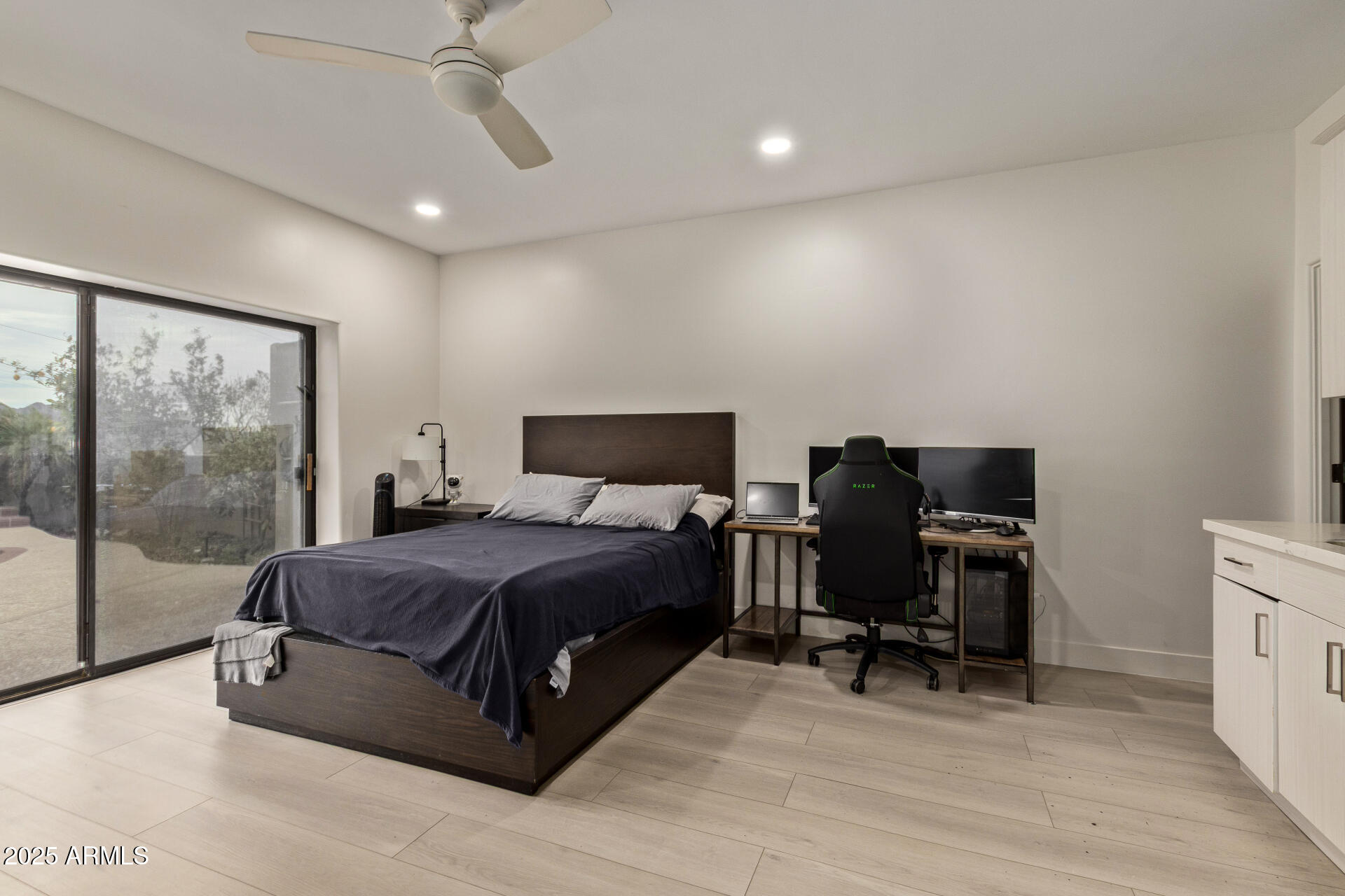10011 North 1st Avenue Phoenix, AZ 85021 - Photo 18 of 23 a spacious bedroom with a bed and a desk