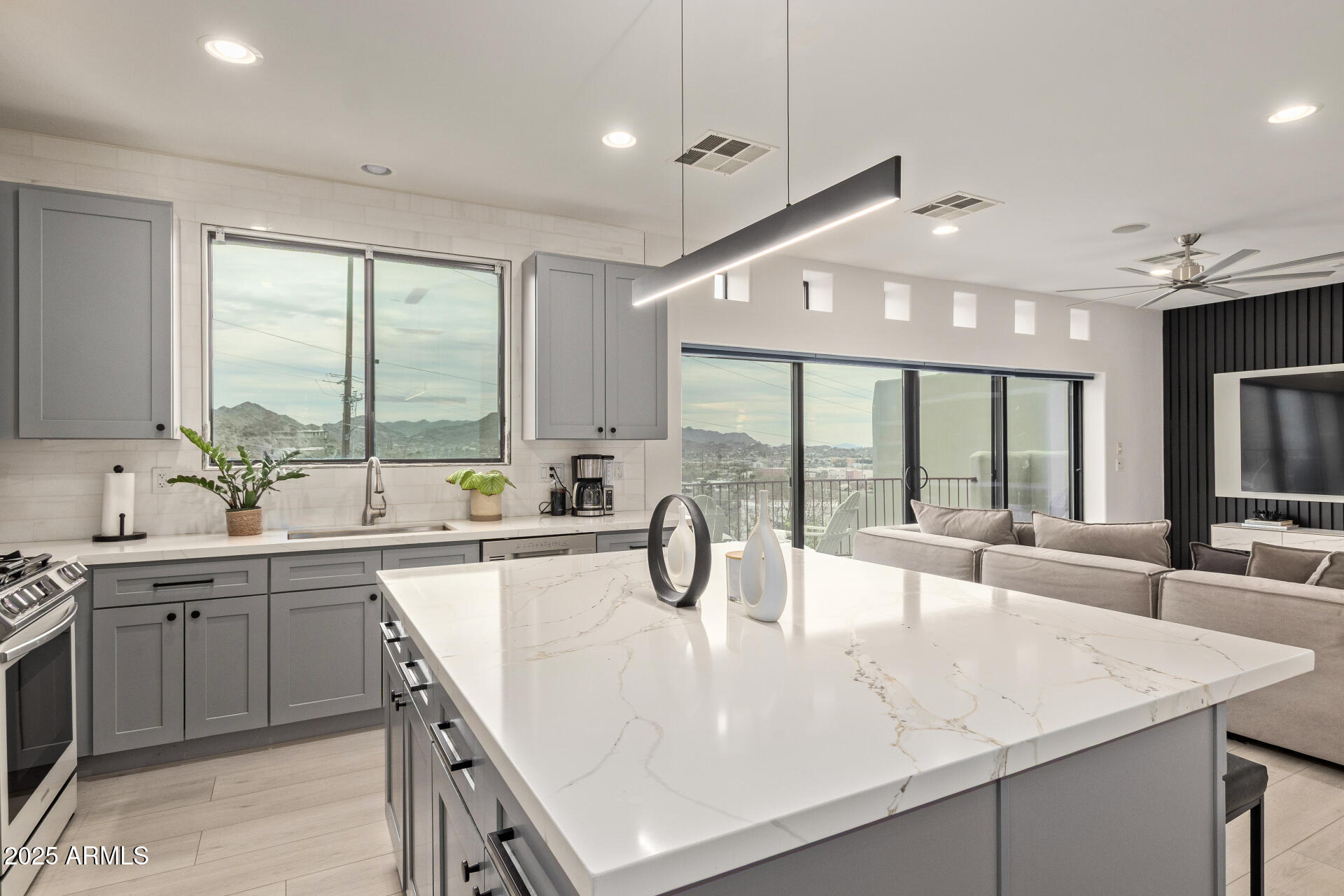 10011 North 1st Avenue Phoenix, AZ 85021 - Photo 3 of 23 a kitchen with a sink and large windows