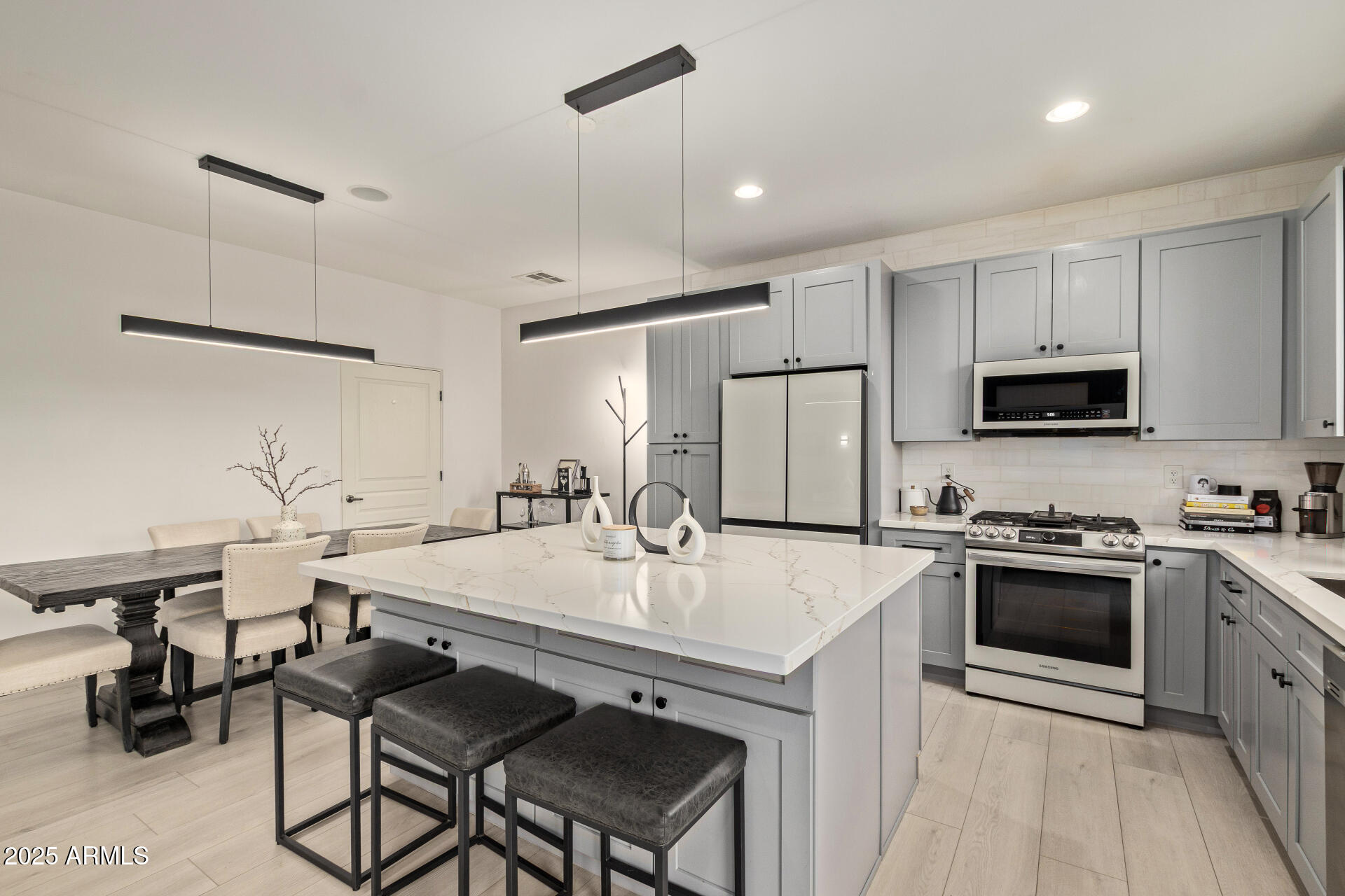 10011 North 1st Avenue Phoenix, AZ 85021 - Photo 4 of 23 a kitchen with a stove a sink and a refrigerator