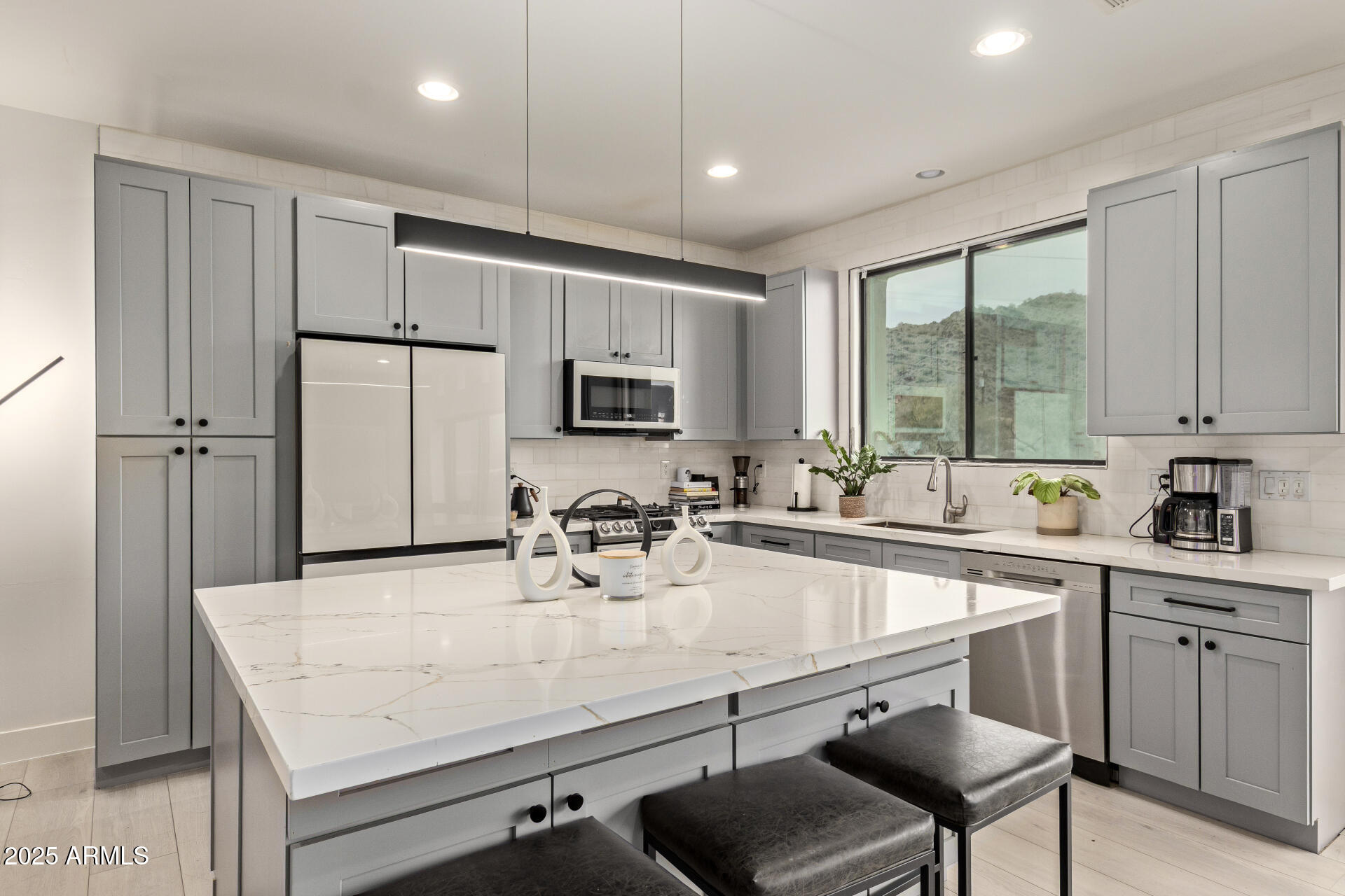 10011 North 1st Avenue Phoenix, AZ 85021 - Photo 5 of 23 a kitchen with a sink stove and refrigerator