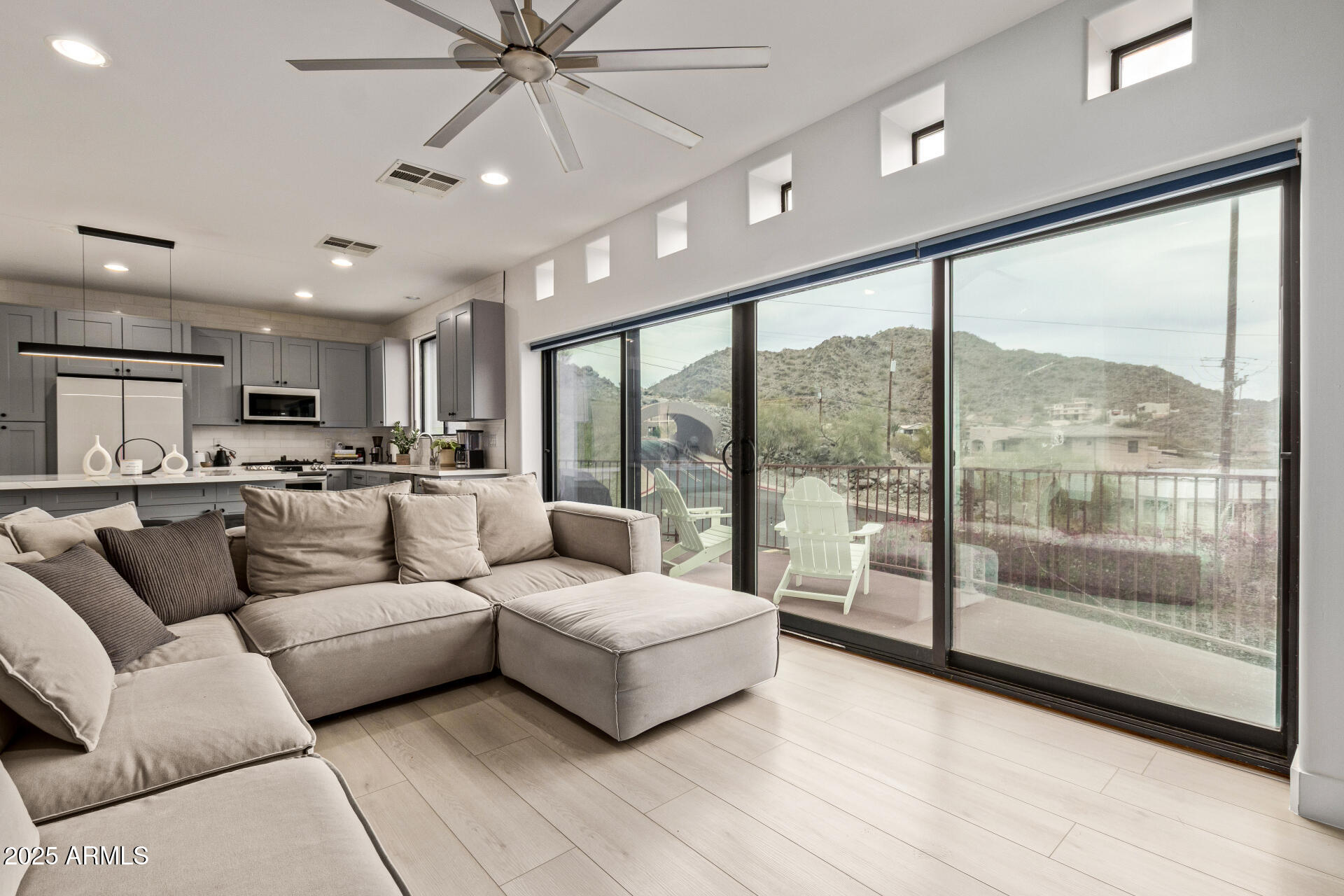 10011 North 1st Avenue Phoenix, AZ 85021 - Photo 7 of 23 a living room with furniture and a large window with view of kitchen